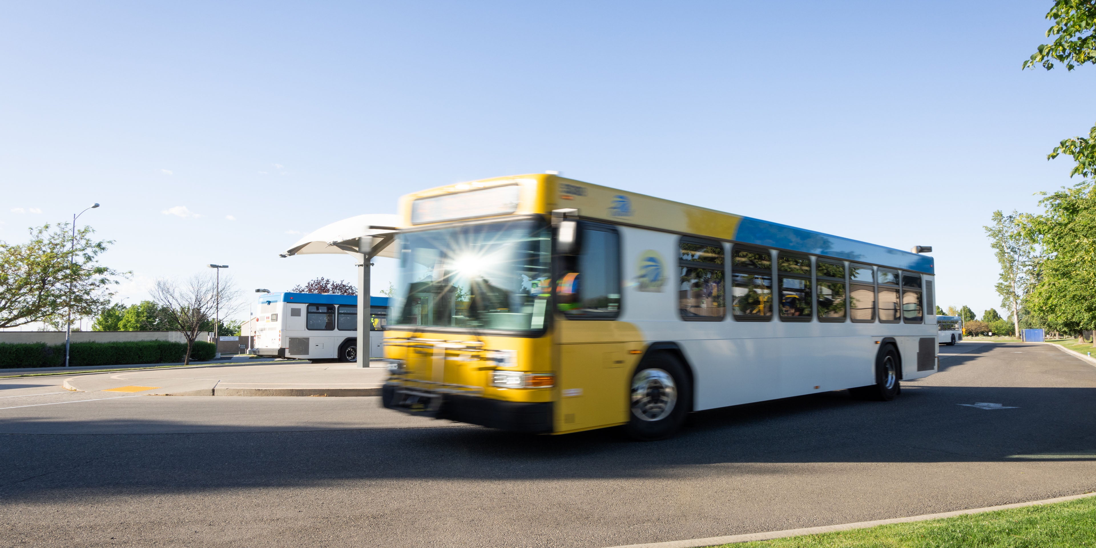 Image of a bus leaving a station.